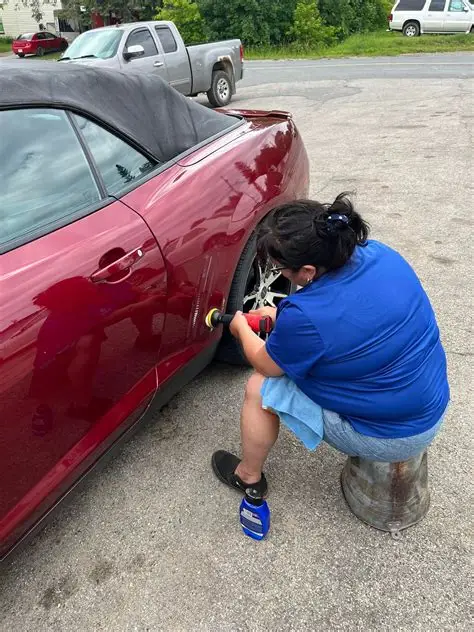 Nancy Glover working on a vehicle