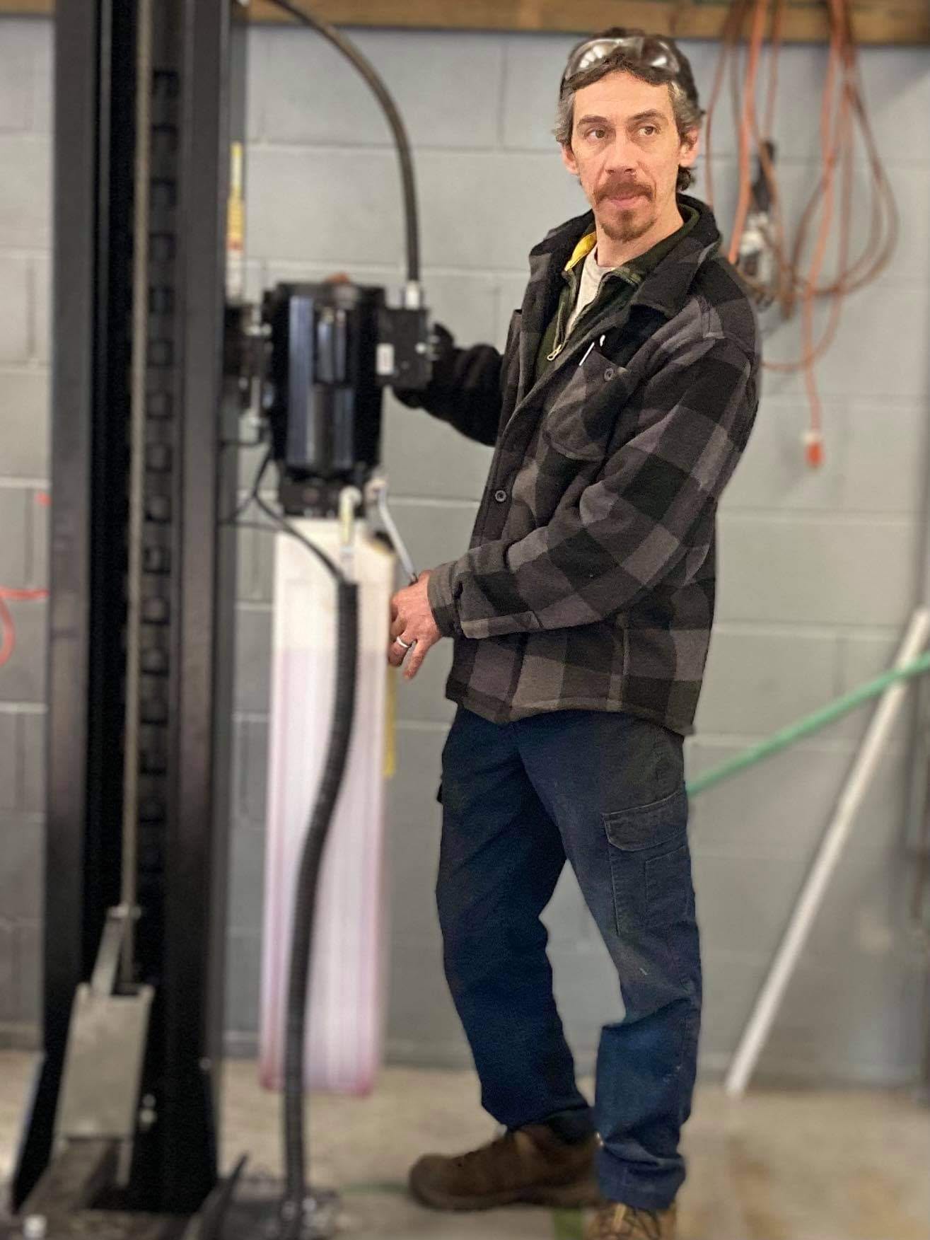 Patrick Glover in the Acme Motors shop